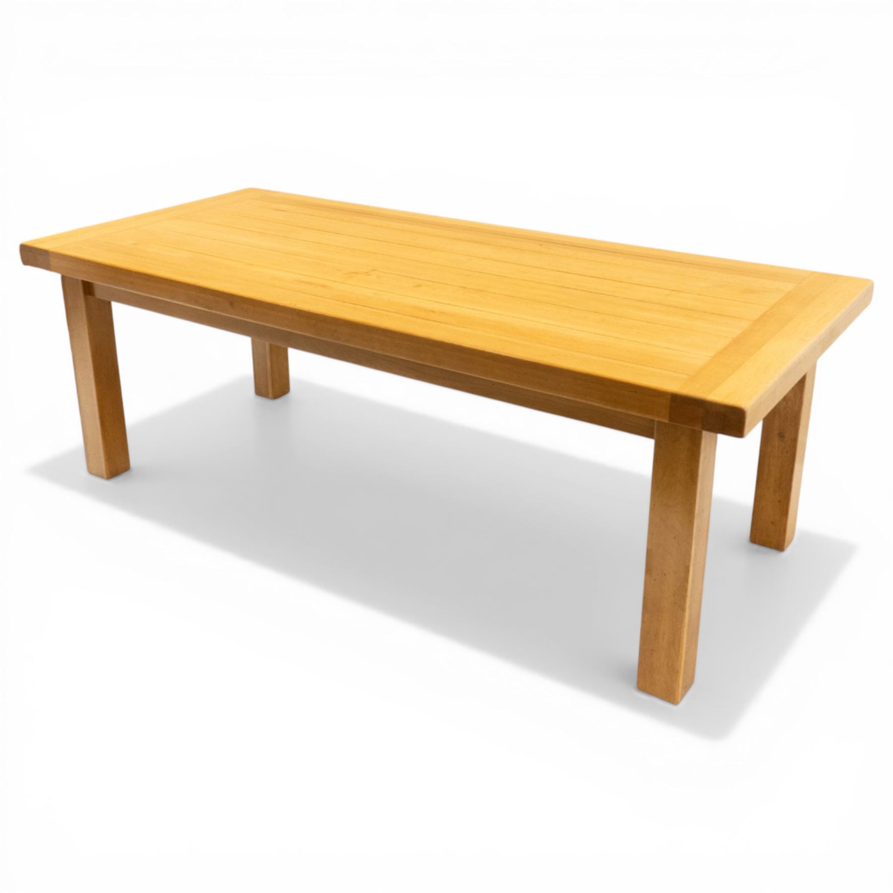 Late 20th century solid light oak dining table, on square supports