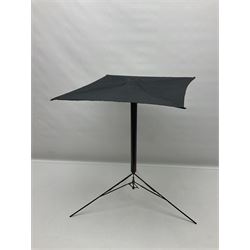 Victorian magician's cane, the mahogany walking stick twisting apart to reveal an internal mechanism, opening to tripod and black silk fold out magician's table, with horn handle and silver mount, hallmarked Birmingham 1891