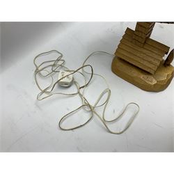 Mid 20th century Paul Caron carved table lamp, modelled as man standing before an oven, the chimney supporting the panelled shade, the base signed P.E. Caron, H42cm