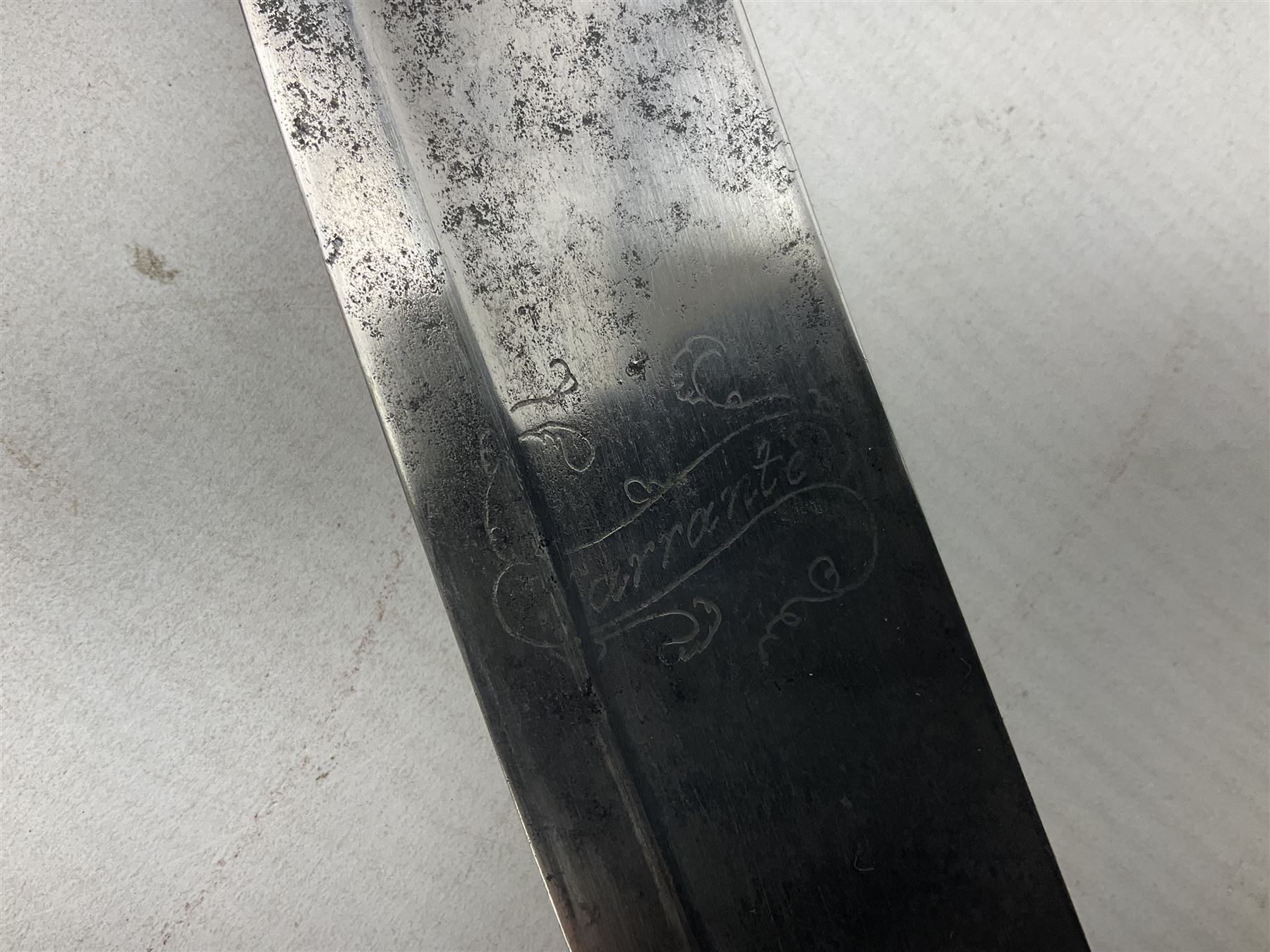 British pattern 1796 Light Cavalry Officer's sword, the 83.5cm curving steel blade marked 'W. Parker London' and 'Warranted' verso, brass stirrup hilt with half-round langets, knucklebow and backstrap with ribbed ivory grip; in brass mounted leather covered scabbard with two suspension rings L97cm overall. This item has been registered for sale under Section 10 of the APHA Ivory Act 