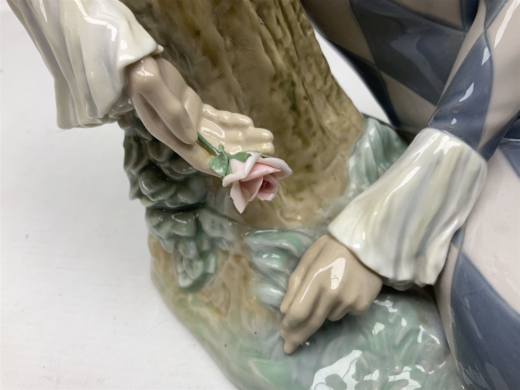 Lladro figure, Harlequin Reclining, modelled as a recumbent harlequin, no 5128, Sculpted by Salvador Furio, year issued 1982, year retired 1987, H28cm 