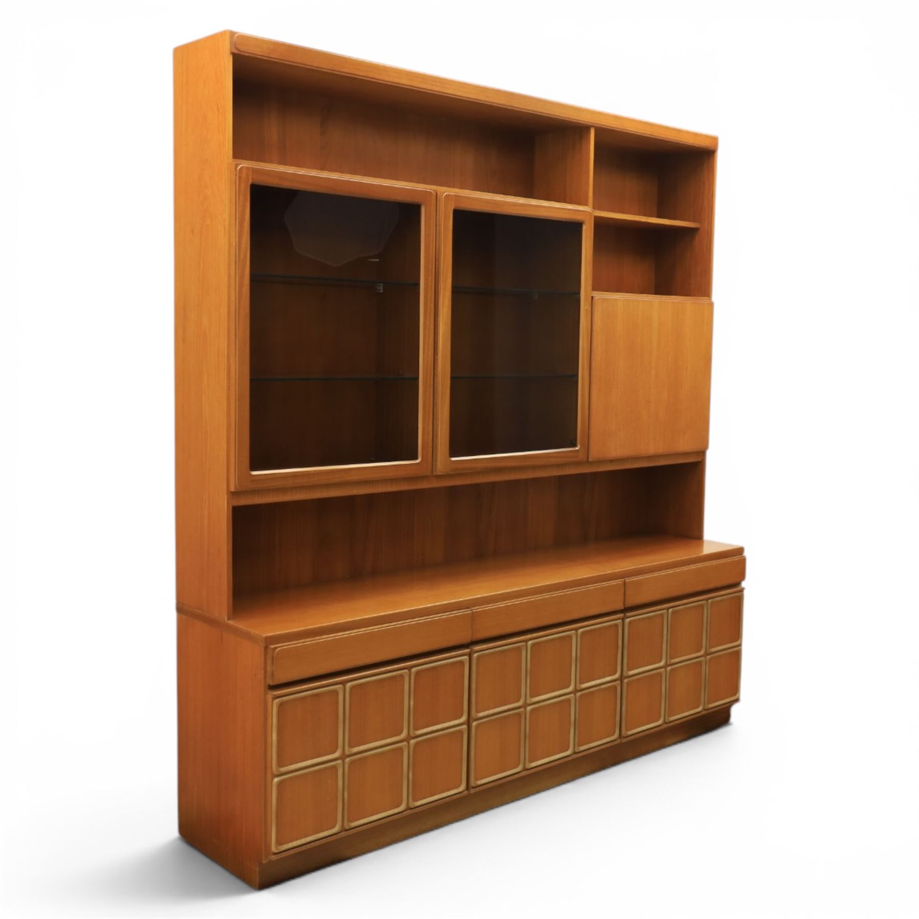 McIntosh Furniture - mid-20th century teak highboard unit, two glazed cupboards enclosing a glass shelved interior, a fall front cabinet to the other side mirrored back, with three frieze drawers one fitted for cutlery, with applied square panels