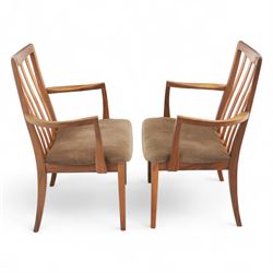 G Plan - mid-20th century teak extending dining table, oval top with integrated extension leaf, raised on tapering legs, together with a set of six slat back dining chairs including two carvers, upholstered in dark green velour (Extends to 210cm)