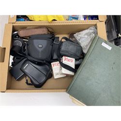 Large quantity of camera equipment in three boxes - Lumix GX1 camera, Canon EOS 500 camera, Lumix FZ100 camera, Pantax  MZ5n, various other cameras, Swift spotting Scope 20 x 60 in box,  Maxtor hard drive, three tripods, Kodak carousel projector, Pradolux slide projector, a selection of camera bags and other camera equipment. 