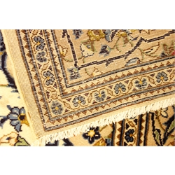  Persian Kashan ivory ground rug, blue interlacing foliage overall design with medallion, 308cm x 203cm   