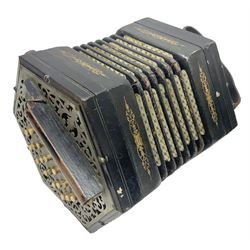 19th century Lachenal concertina of hexagonal form with fretworked nickel ends and thirty-four plus one bone buttons; straps marked Lachenal & Co Makers London and wooden handle stamped English Make Trade Mark L16cm