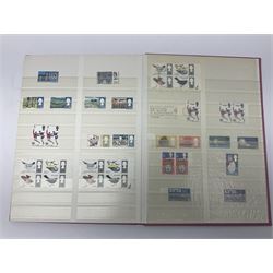 Mostly Great British stamps, including King Edward VII two shillings and sixpence, five shillings and ten shillings, King George V seahorses, King George VI high values, Queen Elizabeth II pre and post decimal etc, housed in a pink stockbook 