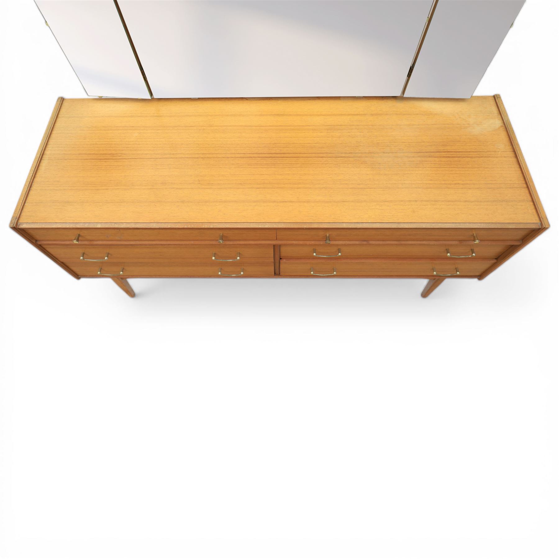 Golden Key By Palatial Ltd - mid-20th century teak dresser, three part mirror above a rectangular top, with six drawers with brass handles and pulls, upon splayed tapering legs 
