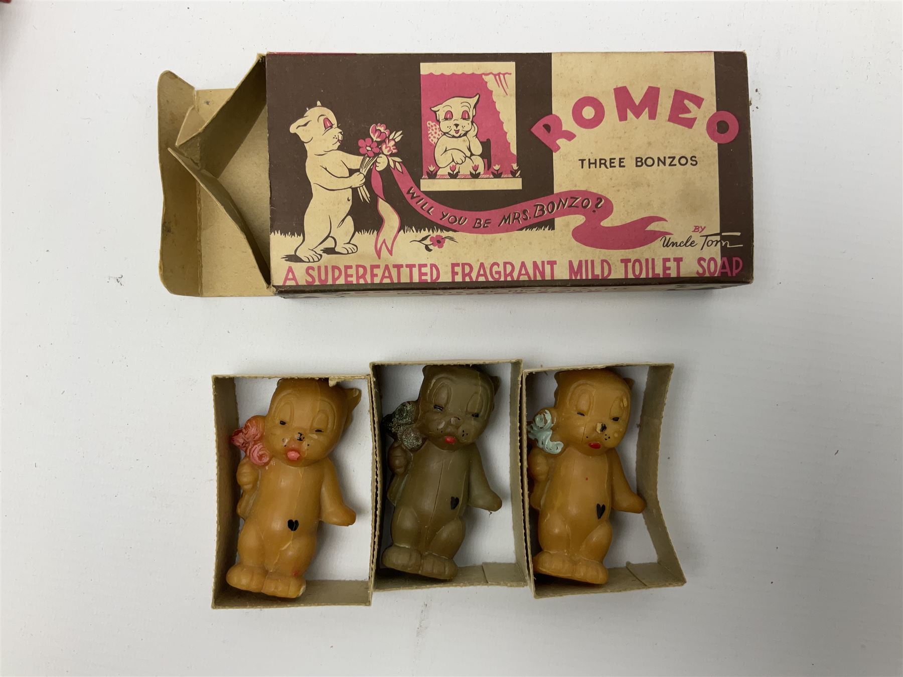 Five novelty soap, comprising Archie Andrews, Three Bonzos, Saucy Sue, Puff Puff bath soap, Festival of Britain 1951, together with pocket wonder library books