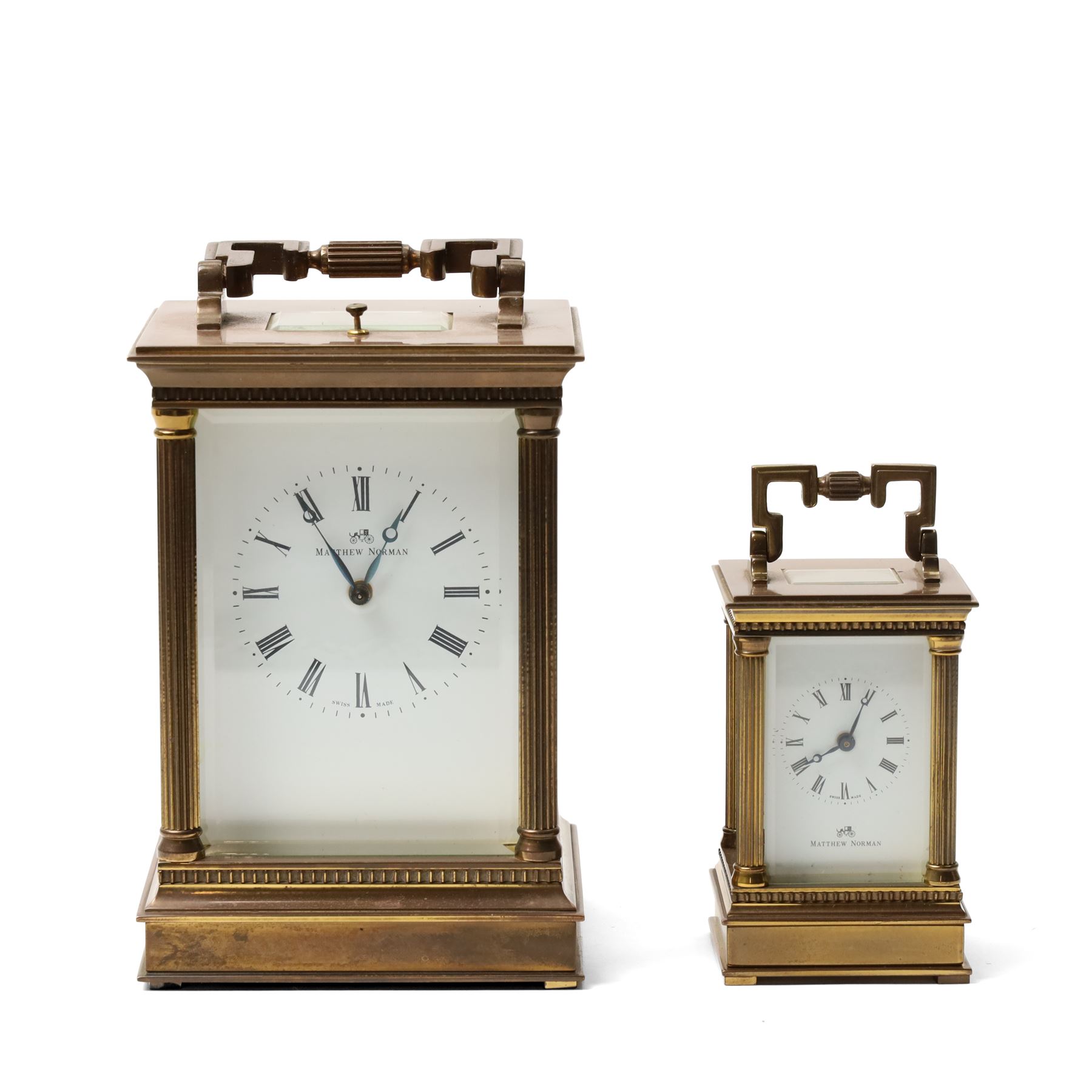 Matthew Norman - Modern repeating carriage clock with Swiss movement, white dial, brass and bevelled glass case H14cm, boxed and a miniature carriage clock by the same maker H9cm, boxed (2) 
