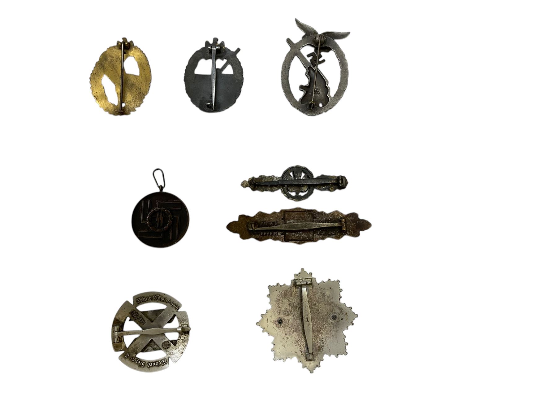 Eight German style badges including Bombers piolet clasp, Proficiency Rune, German Cross in gold etc 