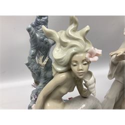 Four Lladro figures, comprising Touch of Class no 5377, Boy Student no 4517, Ocean Beauty no 5785 and Carnival Couple no 4882, largest example H45cm