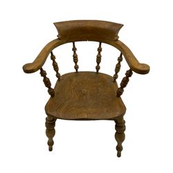 Victorian elm smoker's bow elbow chair, the arms and back raised on turned spindle balustrade, turned supports joined by double H stretchers, figured and dished seat
