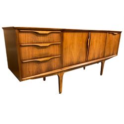 Jentique - mid-20th century teak sideboard, fitted with three drawers, double cupboard and fall front cupboard, raised on tapering supports