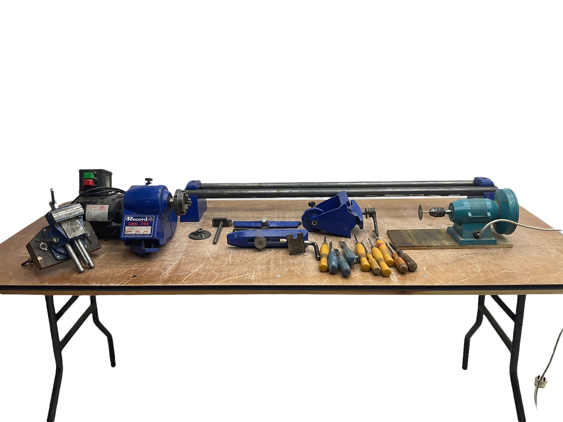 Record wood turning lathe and motor, with a three jaw chuck, tailstock and tool rest, selection of wood turning and woodworking chisels, electric bench grinder with grinding wheel and collet chuck plus a Record bench vice.