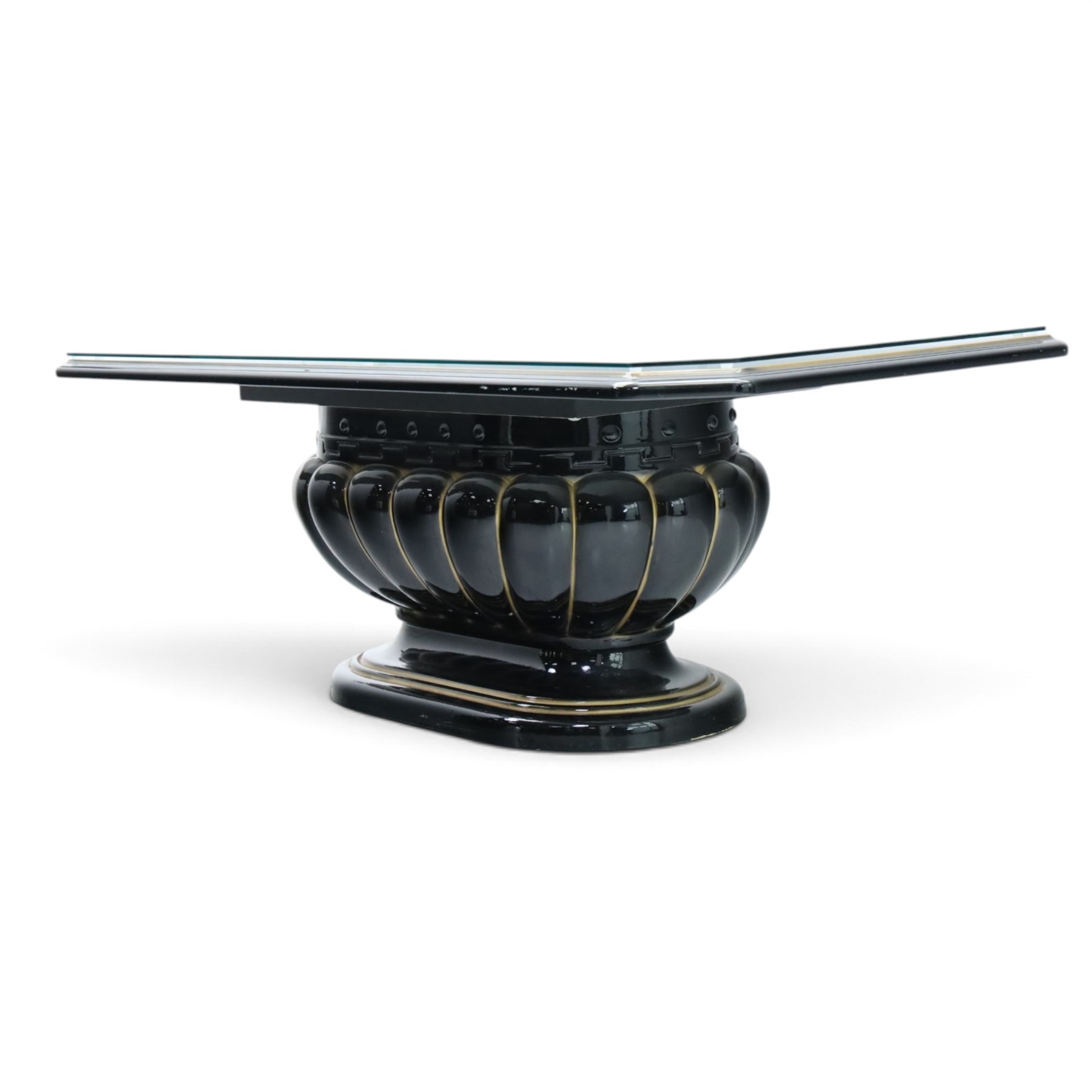 Italian Neoclassical inspired ebonised gloss coffee table, glazed cantered top with Greek key banding, on a shaped pedestal base with gilt highlights and stepped plinth 