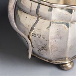 1930s silver three piece tea service, comprising teapot, milk jug and open sucrier, of oval form, the teapot with ebonised handle and finial, hallmarked S Blanckensee & Son Ltd, Chester 1931