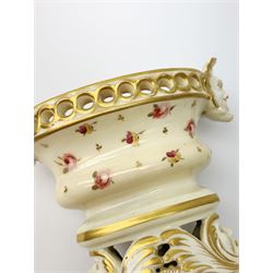 A small Grainger & Co Worcester por pourri and cover, circa 1805-1811, of oval form with twin mask handles and conforming mask detailed base, decorated throughout with painted flowers, inscribed beneath Grainger & Co Worcester, H13cm. 
