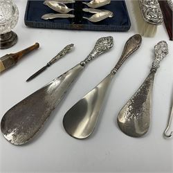 Group of silver mounted items, including cut glass sugar sifter with silver cover, cut glass dressing table bottle, shoe horns, clothes brush, buttonhook and comb with silver handles, etc and a set of silver plated coffee spoons in fitted case