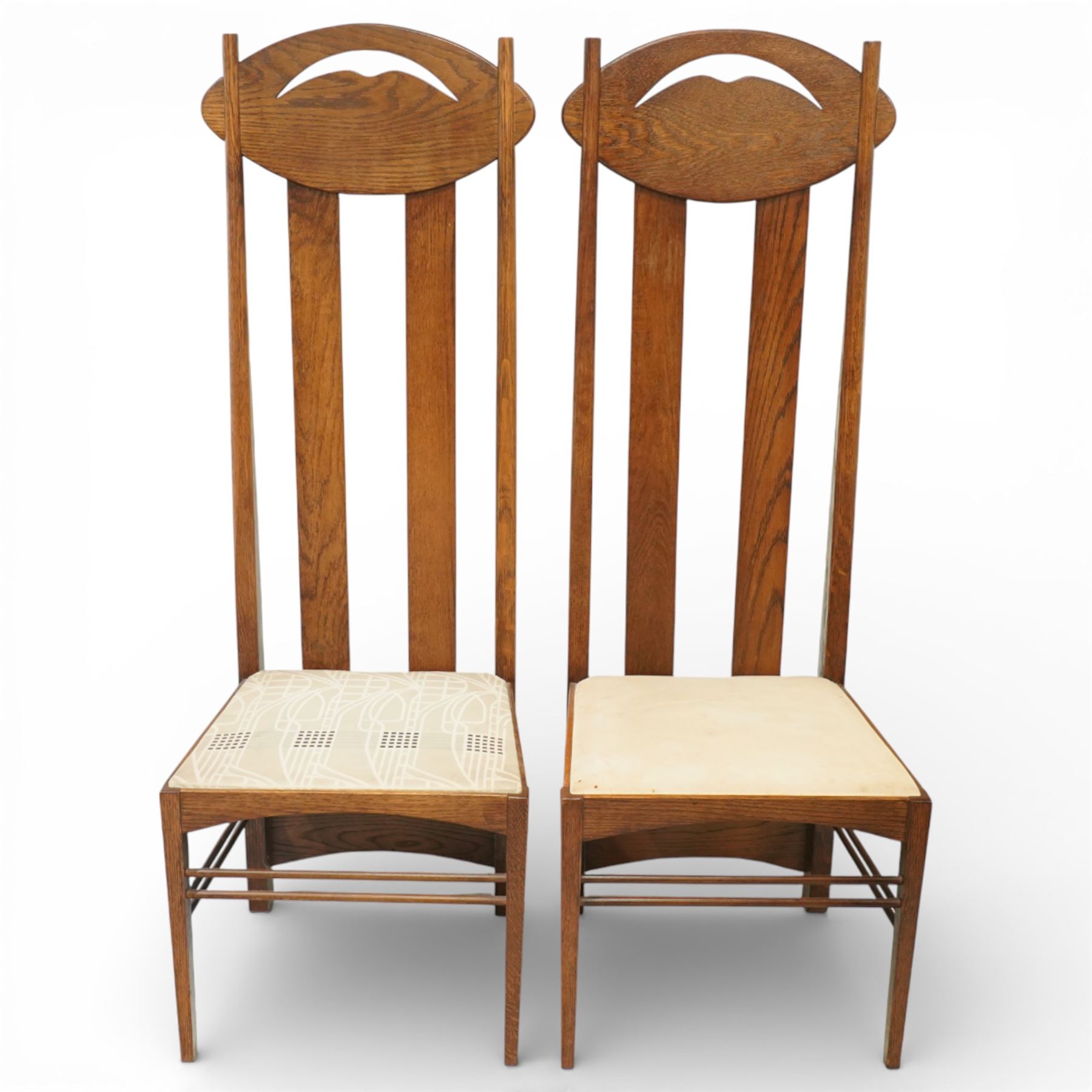 Late 20th century Mackintosh design oak 'Argyle' dining chairs, with elongated backs featuring pierced shaped top rails and twin vertical splats, upholstered seats, raised on square legs with stretchers