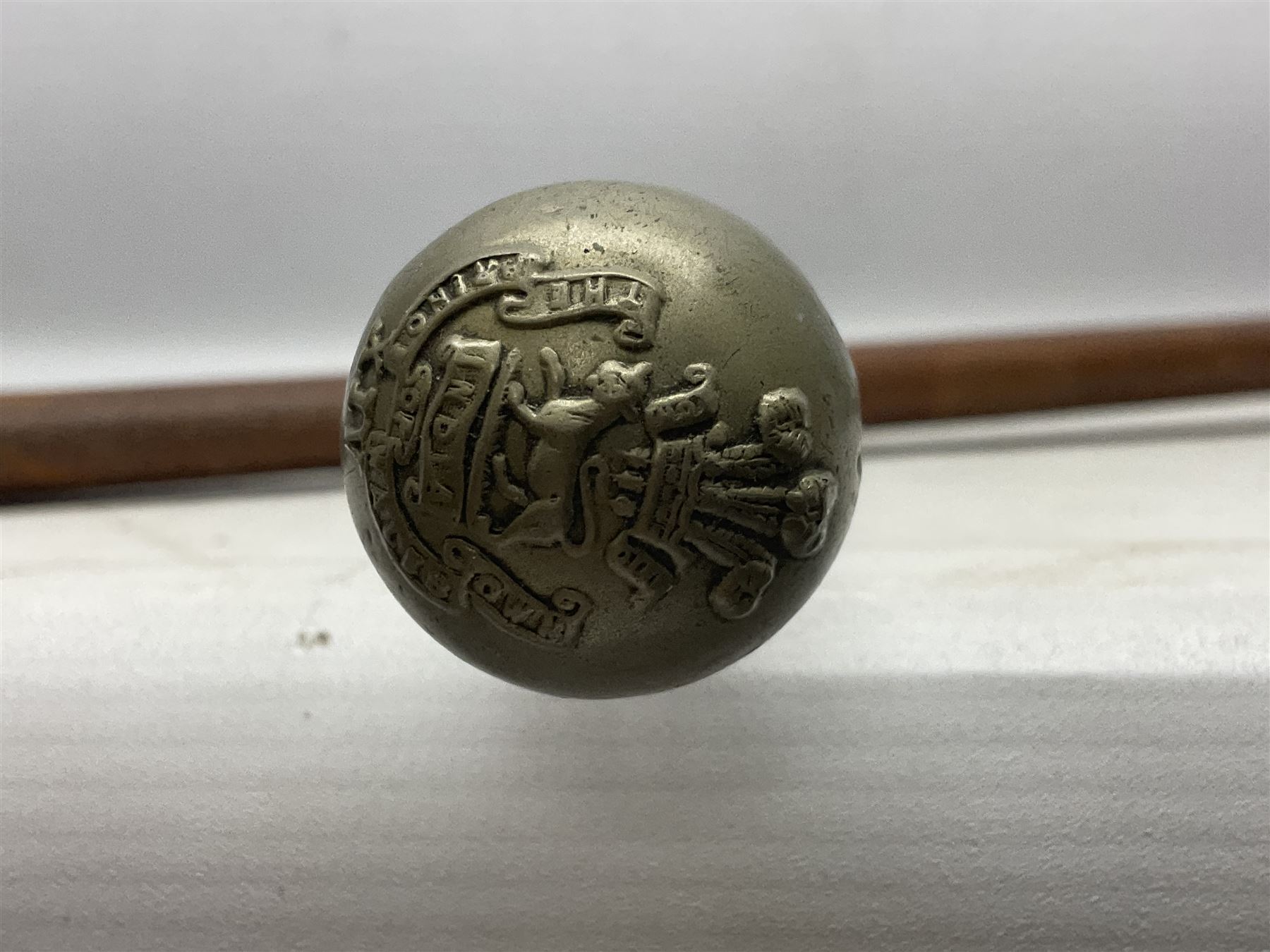 George V 1897 pattern Army Officer's sword by Henry Wilkinson Pall Mall London, the 82.5cm 'London Made' blade etched to both sides with Royal Crests and cyphers etc, pierced half-basket hilt with wire-bound fish skin grip and remains of leather knot strap; in leather covered field service scabbard L101cm overall; and two 14th Prince of Wales Own swagger sticks (3)