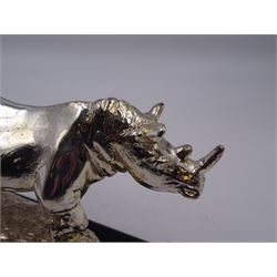 Filled silver model of a rhinoceros by Afrisilver, upon lacquered wooden base, H11.5cm