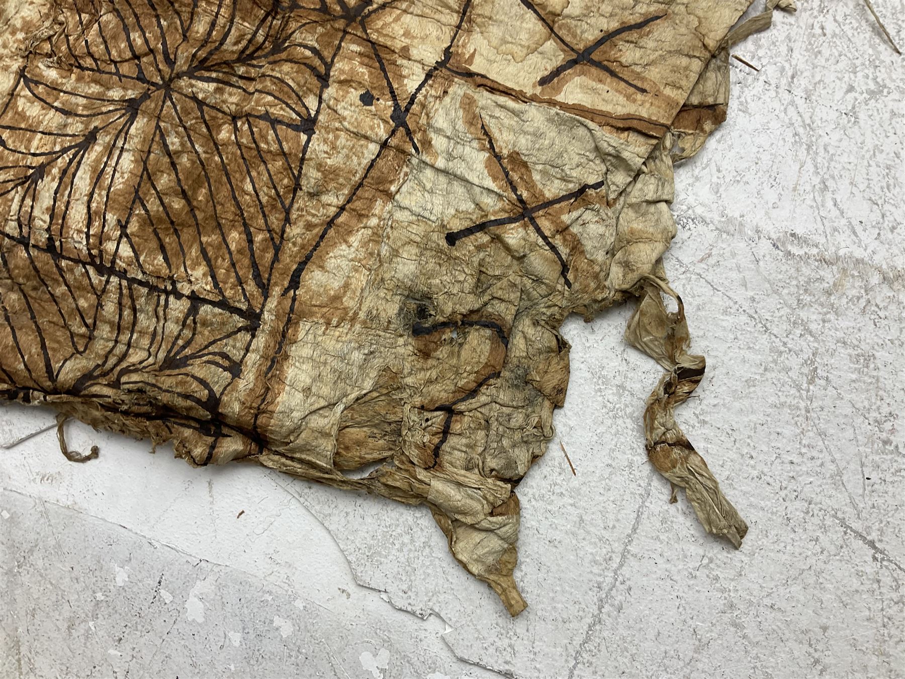 Collection of traditional necklaces from the Solomon Islands, including shell and boar tusk examples, together with a carved canoe prow, with mother of pearl eyes, painted cow hide and a copper plaque, depicting the Solomon Islands, with presentation engraving