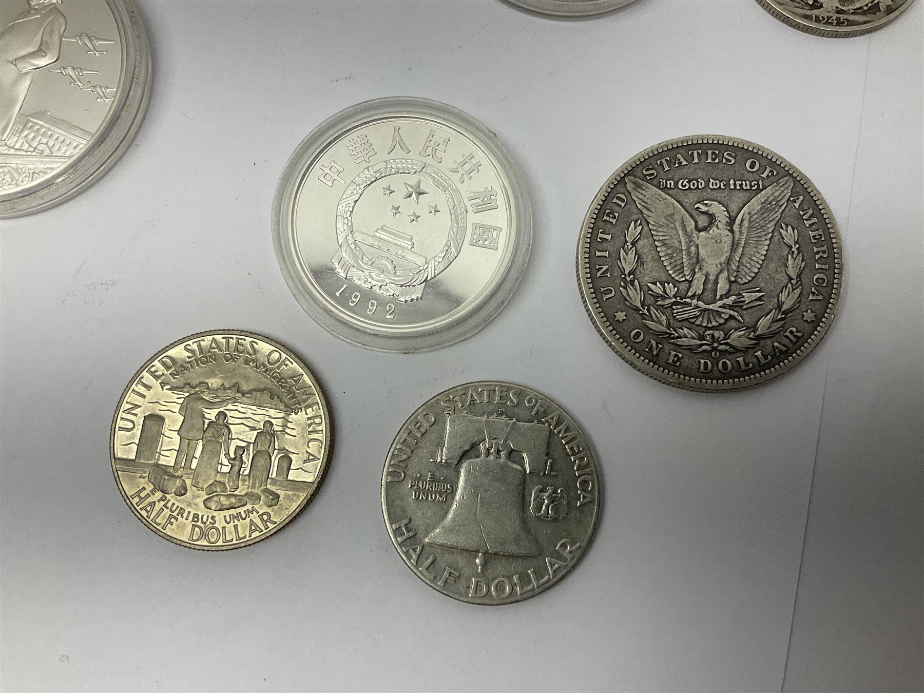 United States of America 1896 Morgan one dollar coin, 1893 'Columbian Exposition' commemorative half dollar, 1945 standing Liberty half dollar, Queen Elizabeth II Australia 1993 one ounce fine silver dollar, Canada 1967 and 1995 one dollar coins etc (15)