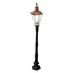 Victorian style cast iron street lamp post, with copper and glass lantern top