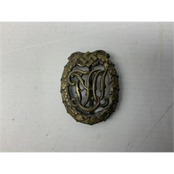 Two WW2 German Sports badges - SA sports badge marked verso 'W.Redo Eigentum D. Obersten SA. Fuhrung Saar Lautern'; and DRL sports badge marked verso 'Wernstein Jena D.R.G.M. 35269' (2)