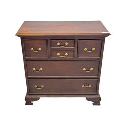 Georgian design mahogany chest, fitted with six drawers, on ogee bracket feet