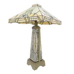 Tiffany style table lamp, the tapering stem and stepped pyramid shade, with naturalistic green foliate decoration on a cream ground, including shade H67cm