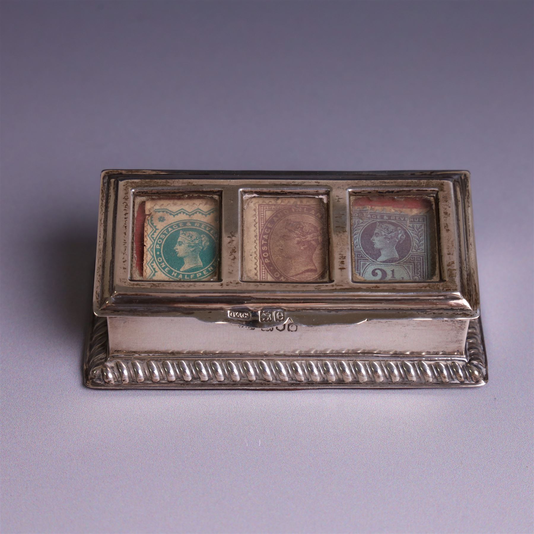 Late Victorian silver mounted stamp box, the hinged lid with three glazed panels, hallmarked Grey & Co, London 1900, together with a late Victorian silver hair comb and a cased set of six silver coffee spoons