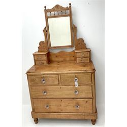 Victorian pine dressing chest, raised mirror back, four trinket drawers above two short and two long drawers, turned supports 
