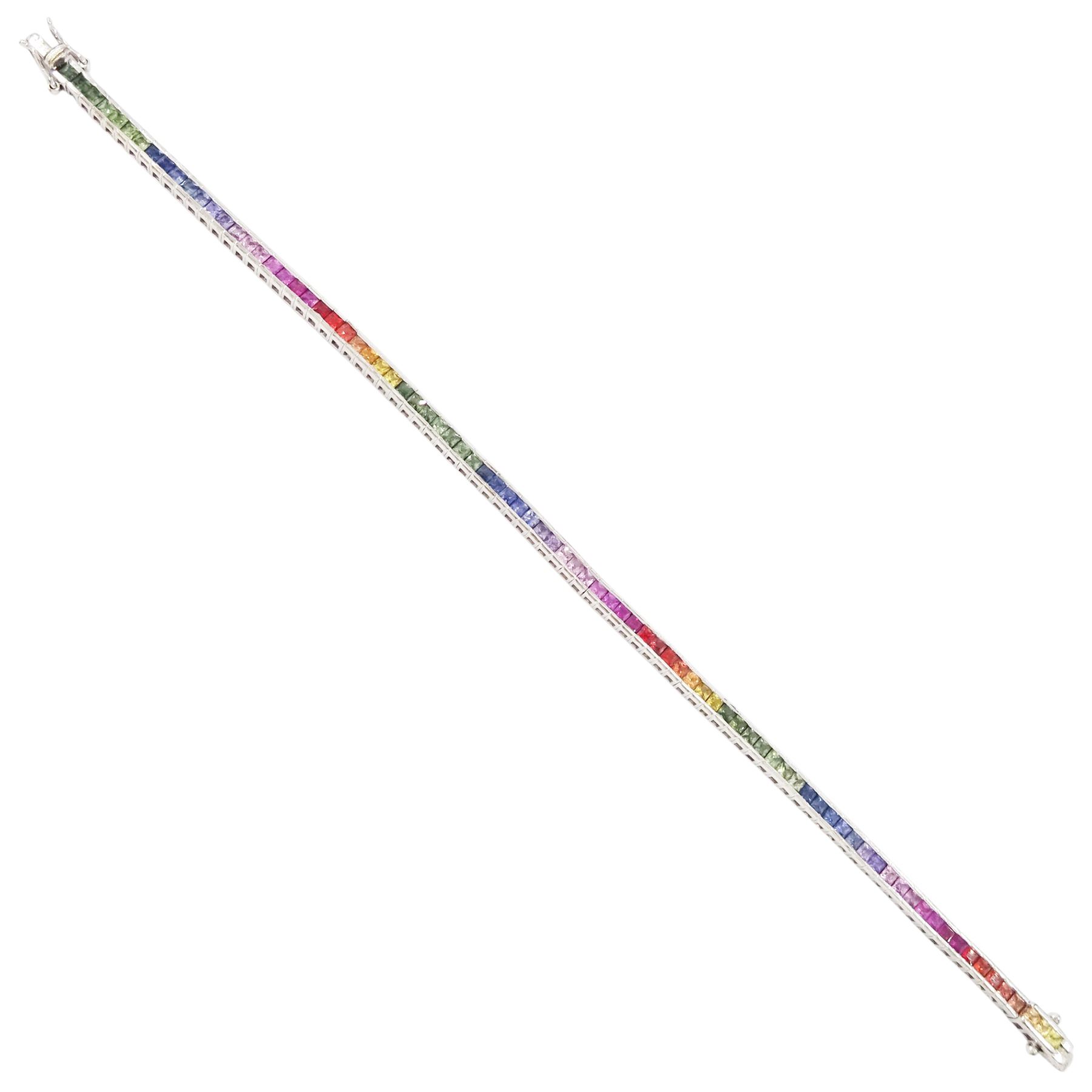9ct white gold rainbow sapphire bracelet, channel set with eighty-five square cut fancy coloured sapphires, hallmarked, total sapphire weight approx 4.85 carat