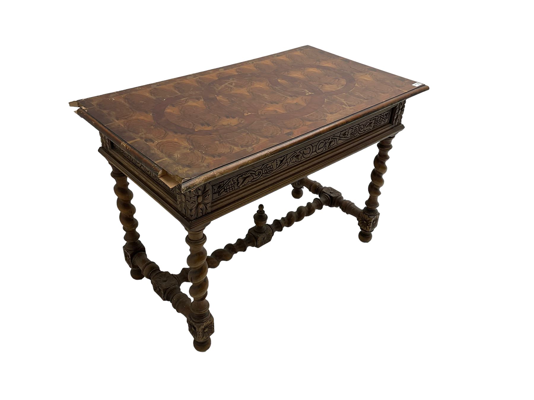 Early 20th century carved oak side table, the rectangular top with cross section inlay, frieze carved with foliate decoration, raised on spiral turned supports united by barley-twist stretcher with finial