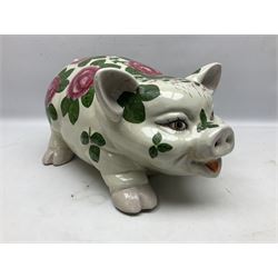 Large ceramic figure of a pig decorated with roses, L45cm