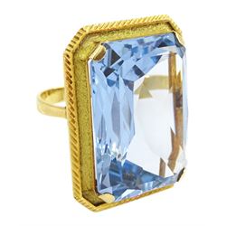 Gold synthetic spinel ring, single octagonal cut synthetic spinel with textured and engraved border