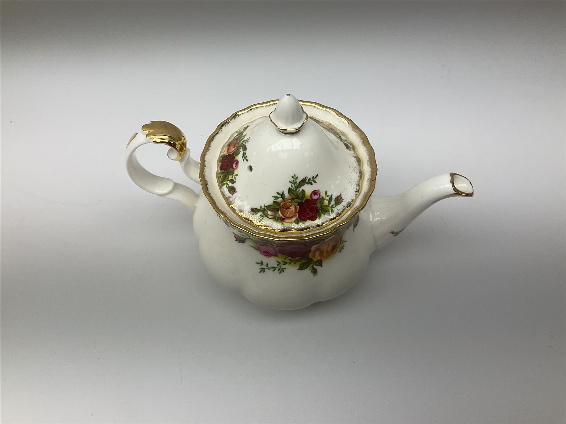 Royal Albert Old Country Roses pattern tea set, comprising teapot, coffee pot, six teacups and six saucers, five side plates, further teacup with joined saucer and side plate, open sucrier, milk jug, cake plate, and preserve pot and cover, together with Royal Albert Jubilee Rose pattern sauce boat and stand, and Royal Albert Lavender Rose pattern cake stand. 