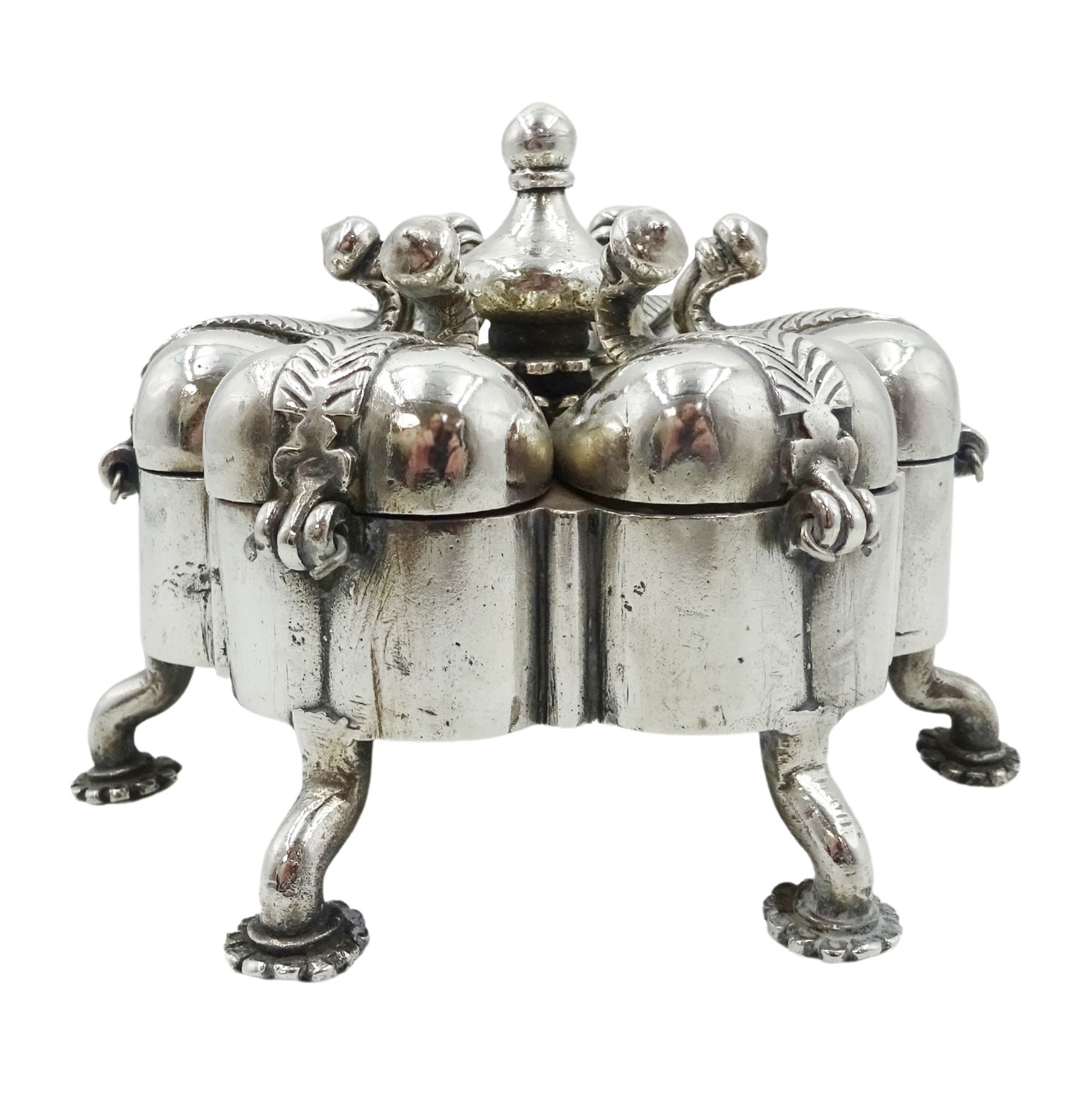 Indian silver spice box/pandan, probably 19th century, modelled in the form of a stylised flower with six lobed divisions with hinged covers, secured by a central screw threaded rod with baluster finial, upon six legs with flower pad feet, H9cm, approximate gross weight 23.79 ozt (740 grams)