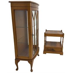 Yew wood bow-front display cabinet, astragal glazed door enclosing two glass shelves, on cabriole feet (W61cm D36cm H113cm); and a matching yew wood two-tier lamp table, single drawer fitted to base (W48cm H55cm)