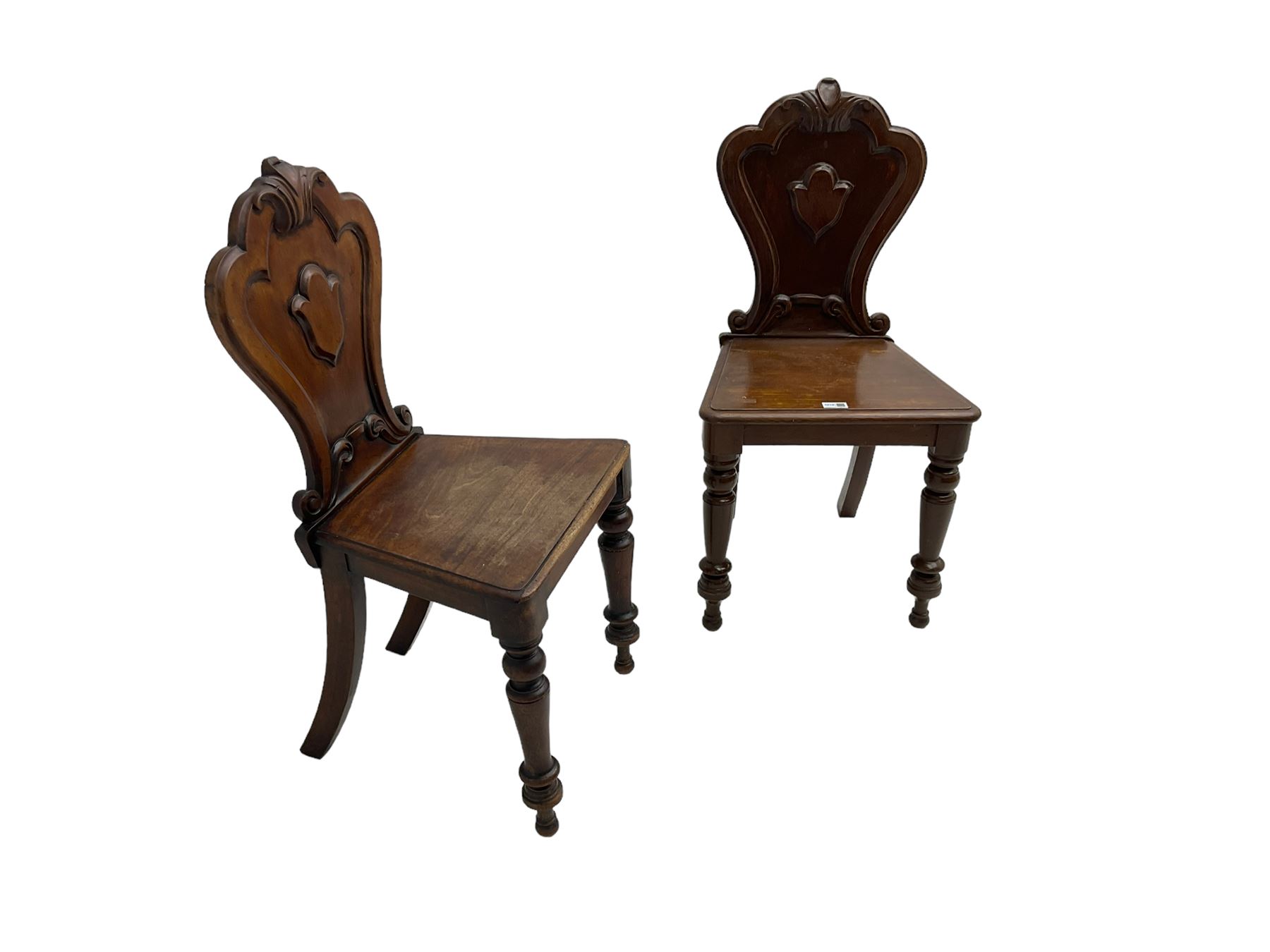Pair of Victorian mahogany hall chairs, shaped moulded back carved with cartouche, moulded seat on turned front supports