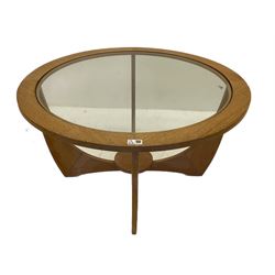 Pair of mid-20th century teak circular coffee table, inset glass top, with under-tier