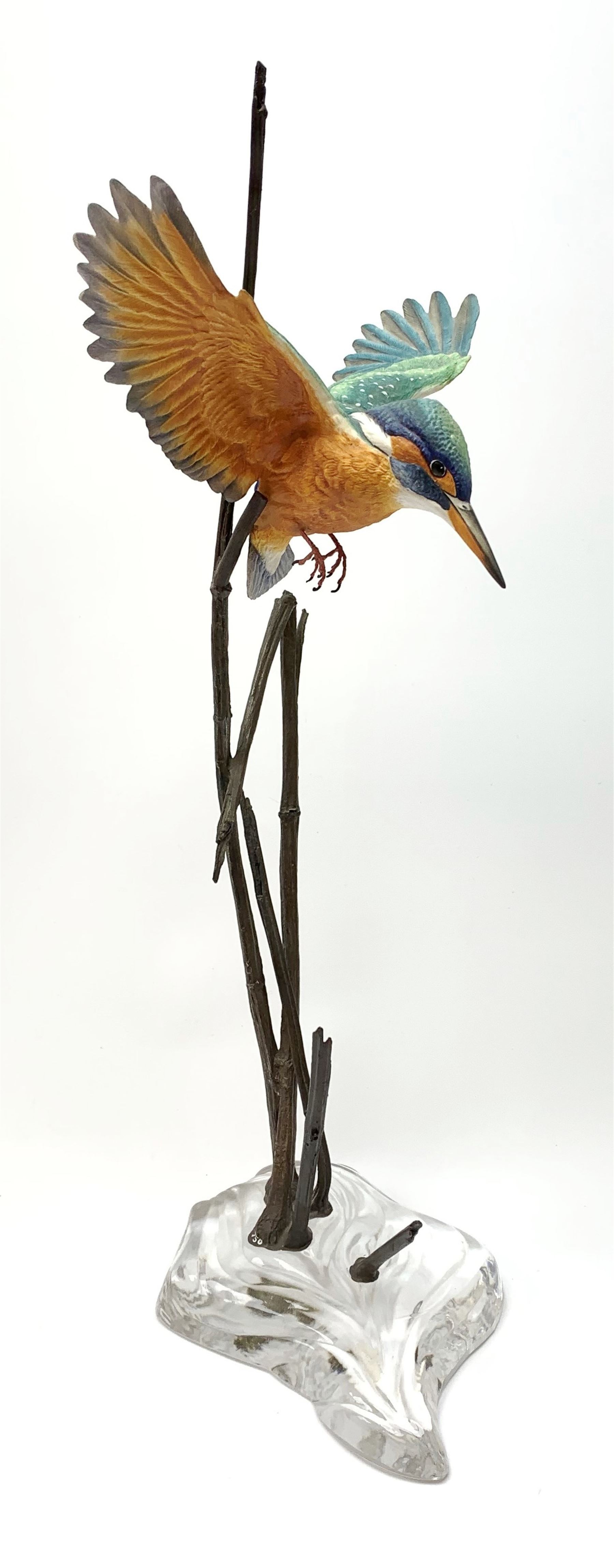 David Fryer Studios for Royal Worcester, a limited edition bronze and porcelain model of a kingfisher in flight, supported by bronze rushes, upon a clear base, signed D Fryer, and numbered 206/750, H48cm. 