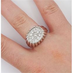 White gold diamond ring, fifteen pave set round brilliant cut diamonds, in an oval setting, stamped 18ct, total diamond weight approx 0.70 carat