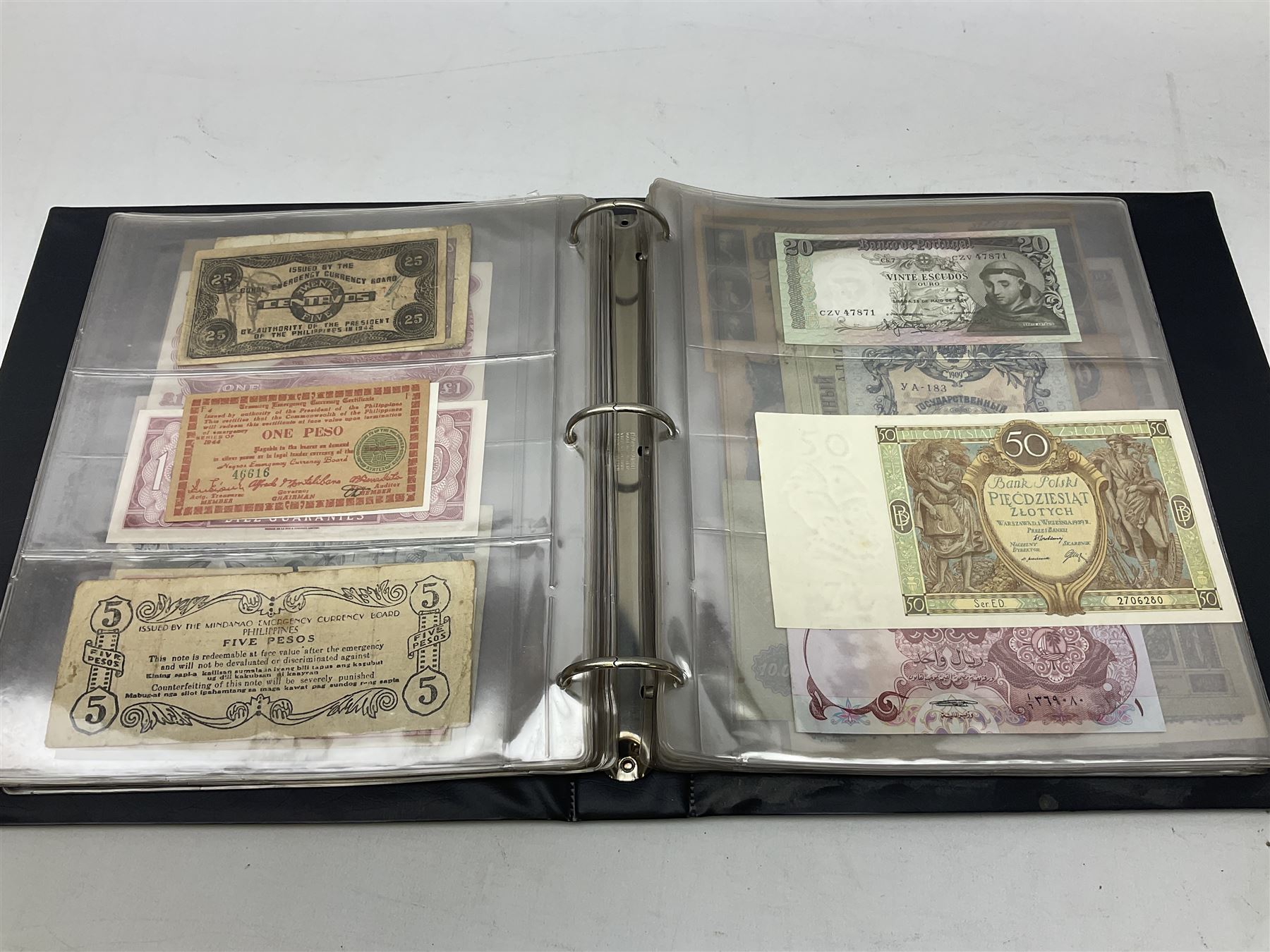 World banknotes, including Queen Elizabeth II The States of Jersey one pound 'DB202703', five pounds 'BB527762' and ten pounds 'AB651481', reserve bank of New Zealand two dollars '1L3 741894', King George V Straits Settlements one dollar 1st January 1935 'F/83 28924', various Bank of England notes etc, housed in two ring binder albums