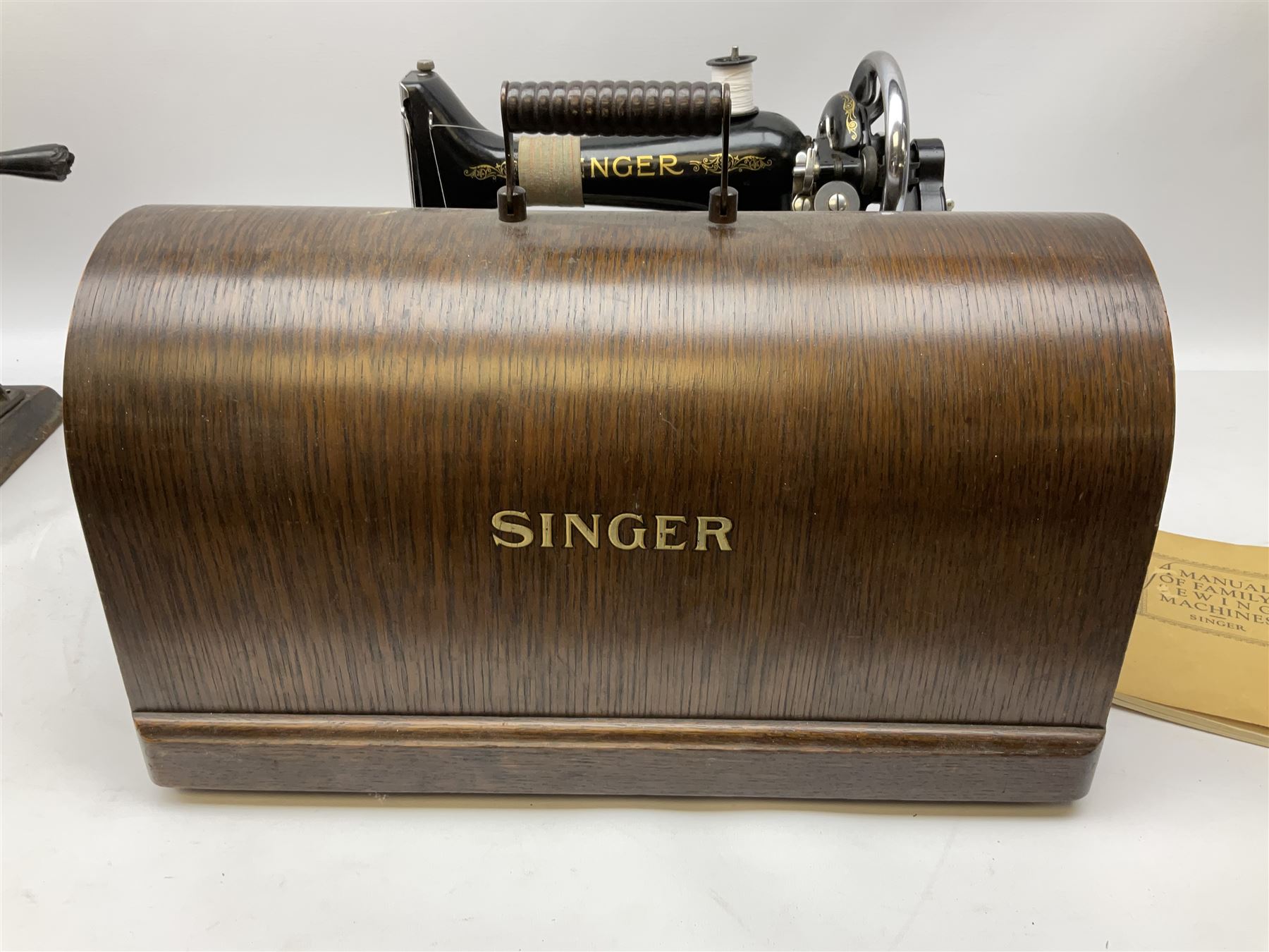 Singer sewing machine no. EA584046 in case (missing key) and Singer Manual of Family Sewing Machines