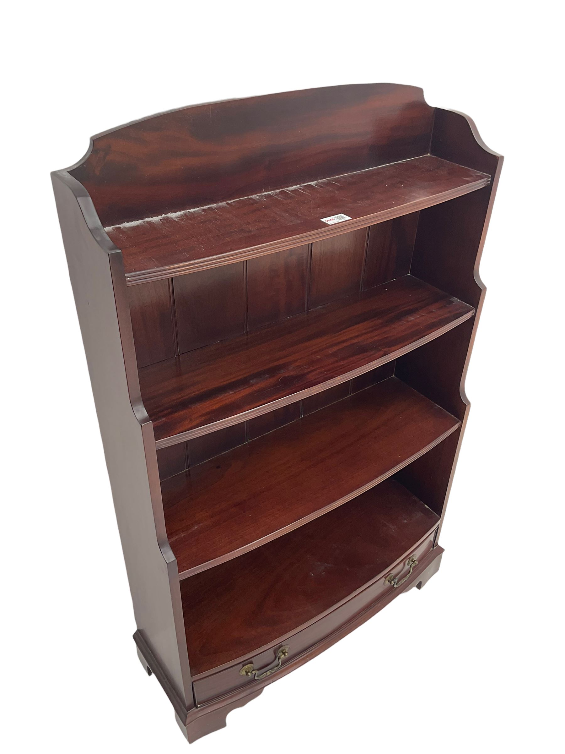 Mahogany bow fronted water fall bookcase fitted with drawer