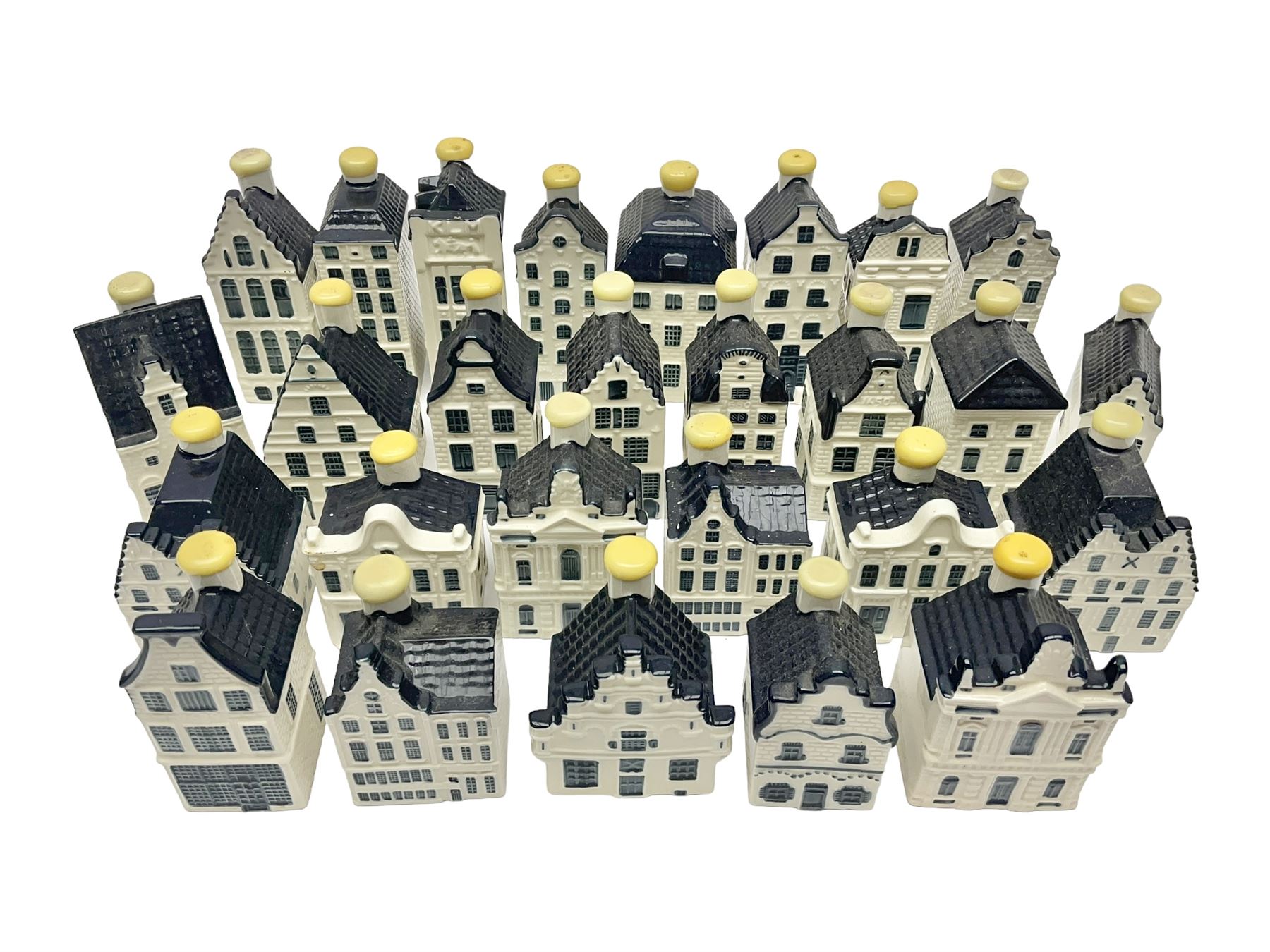 Twenty seven KLM Bols Blue Delft's decanters in the form of Dutch houses, some with contents