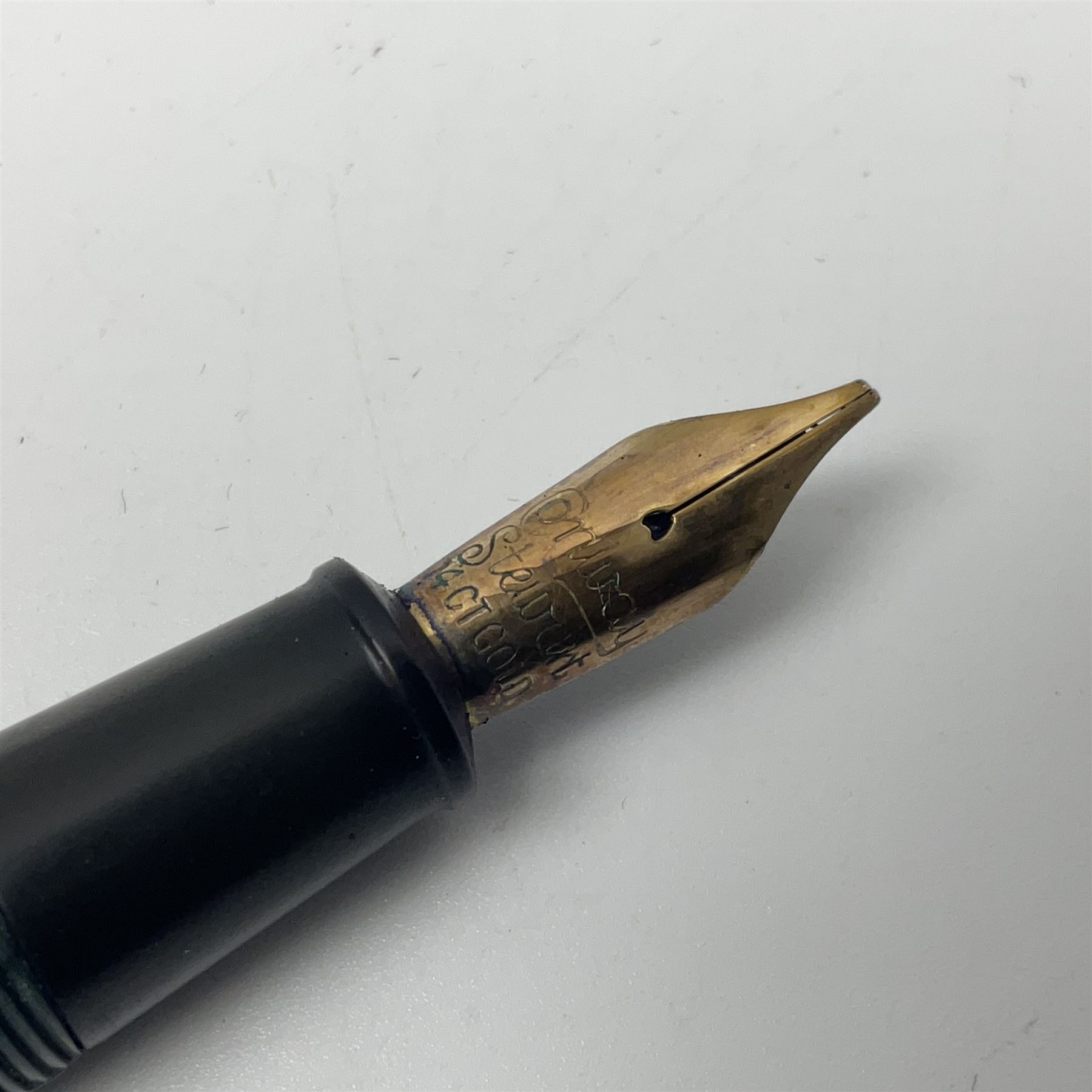 Four fountain pens, each with 14ct gold nibs, comprising Mentmore Paramount, Parker Junior Duofold, Conway Stewart marbleised pen and Waterman's, together with a 14ct gold Conway Stewart 5B nib